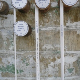 Ribbons hanging down from the reels are embroidered with the names of the workers' children