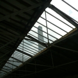 View through the glass roof of the Spinning Room, and the mill chimney